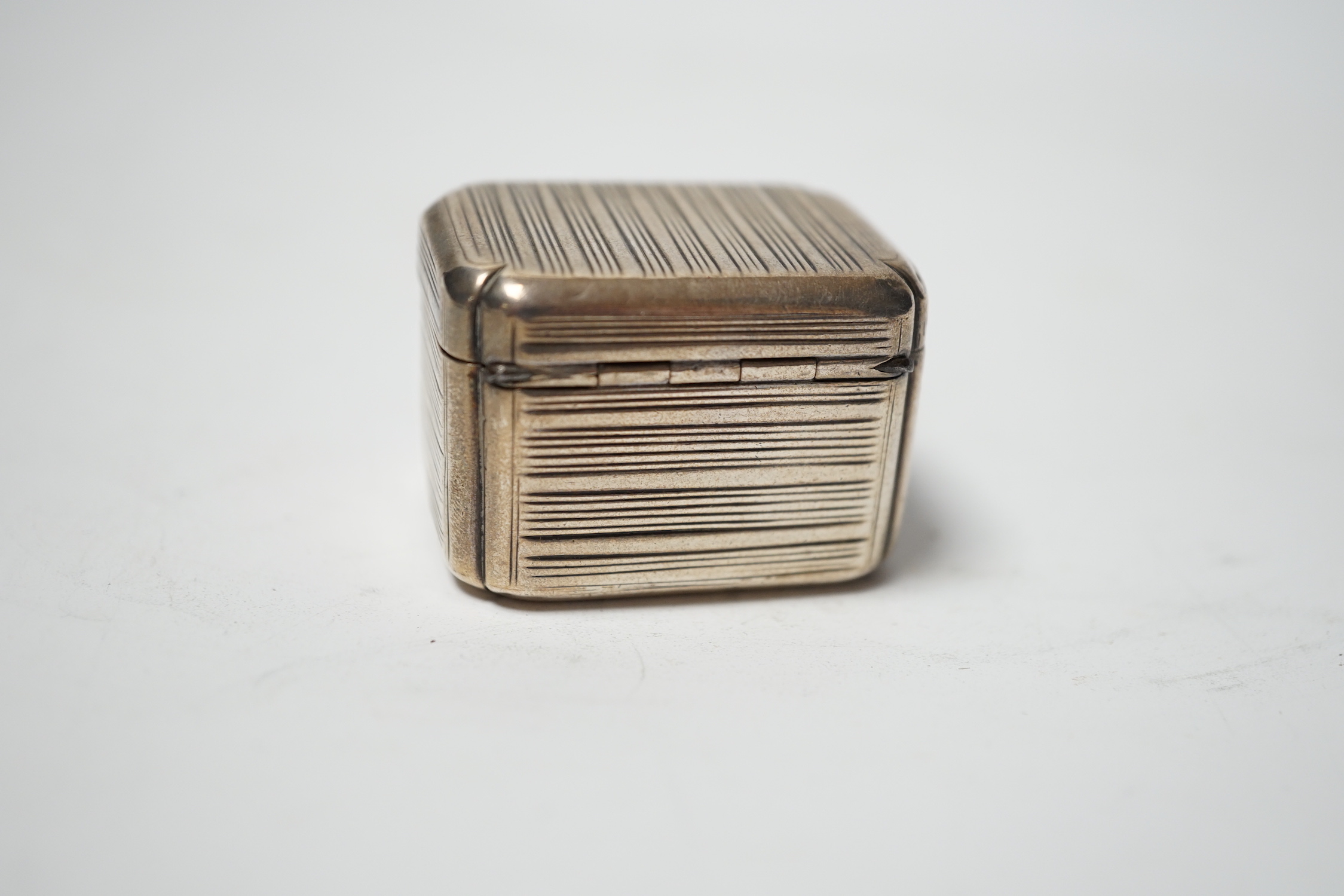 A George III reeded silver nutmeg grater, maker's mark rubbed, London 1812, 37mm.